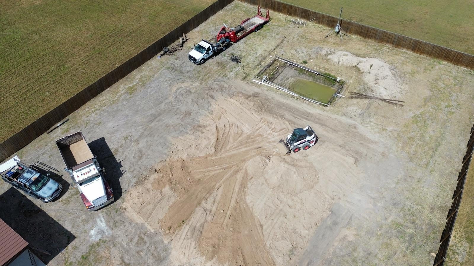 Aerial view of a lot being prepared with equipment