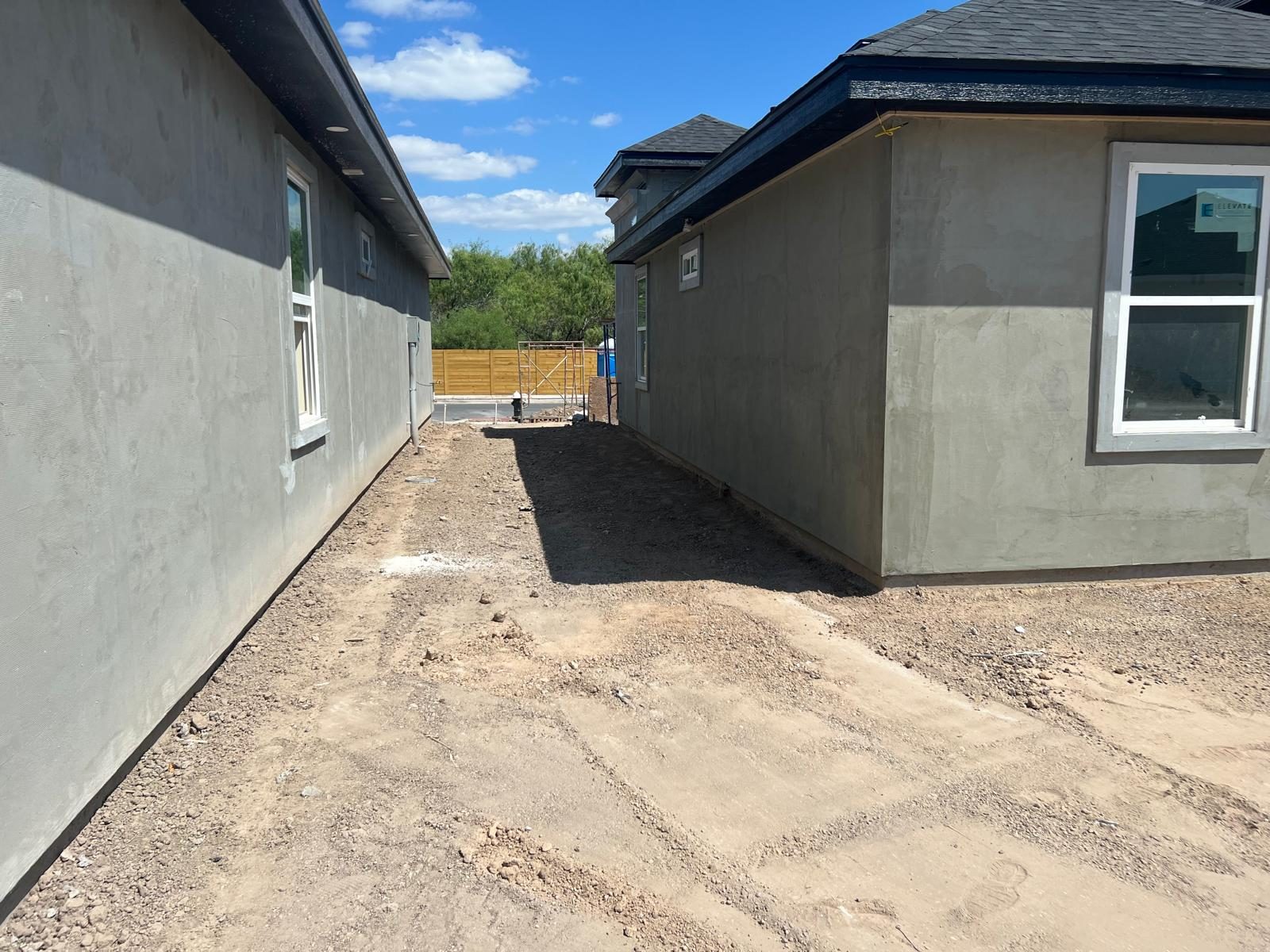 Graded side yard next to a new home